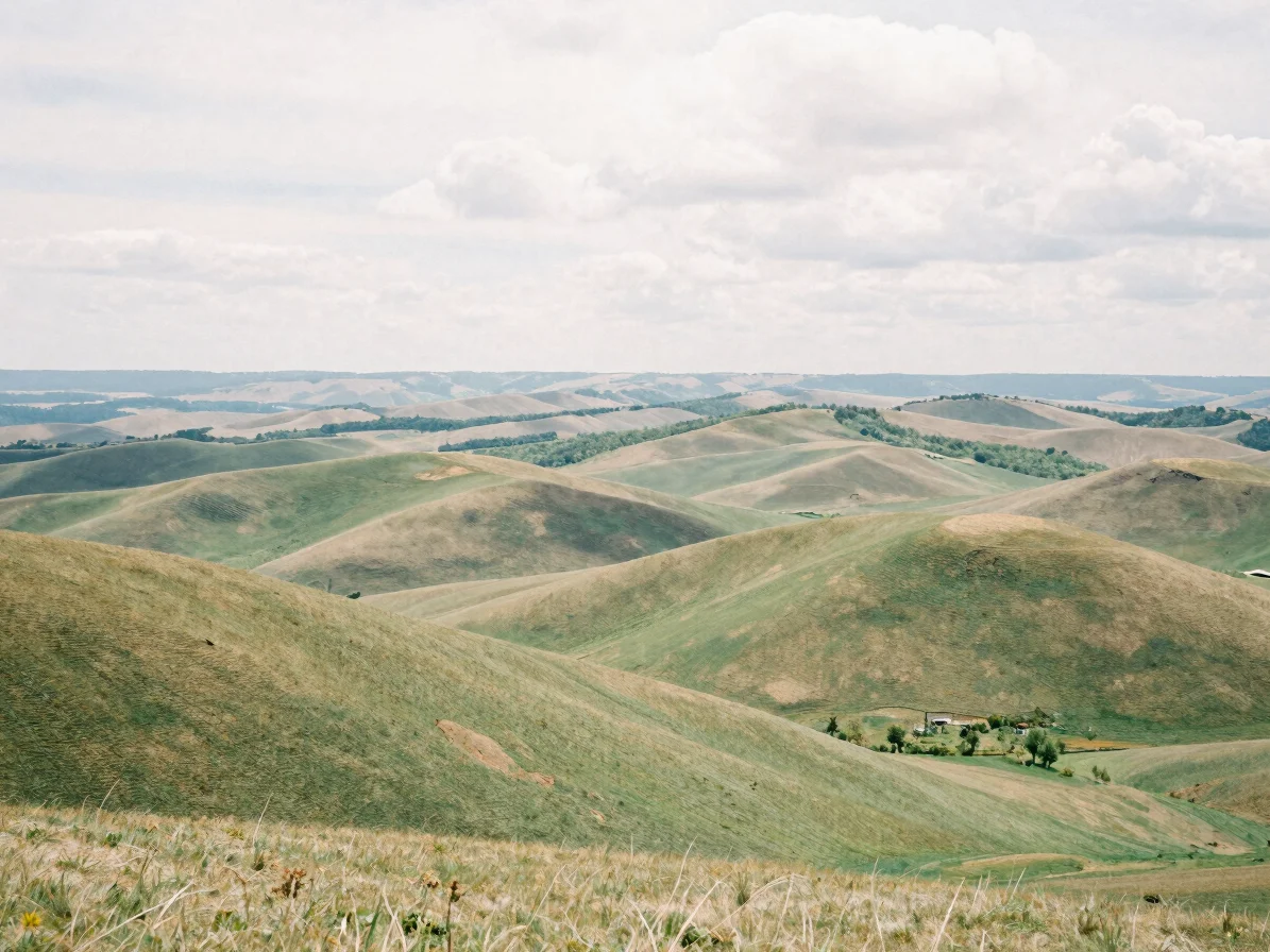 Panoramic view of the Auvergne volcanic plateaus in soft overcast